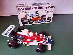 Brinquedo plástico usado carro  Formula 1 à pilha, automatic stop'n Go com caixa 27cm funcionando