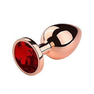 PLUG ANAL MEDIO EM AÇO ROSE COM CRISTAL BRILHANTE VERMELHO