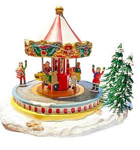 Vila Natalina Carrossel no parque com luz e movimento