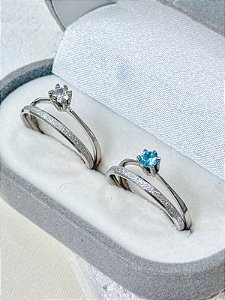 Par de aliança Minilover + Solitários cristal e azul - Aço Inox