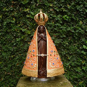 Imagem de Nossa Senhora Aparecida em terracota com detalhes em dourado e cristais coloridos
