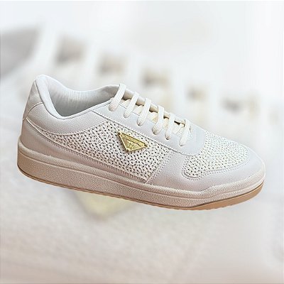 Tenis off white com detalhes dourados