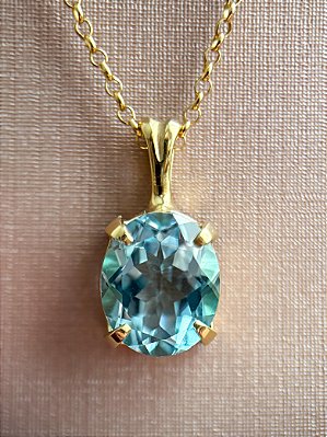 Pingente Oval -ouro amarelo 18k e topázio sky