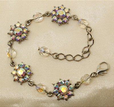 Tornozeleira flor de strass base prata