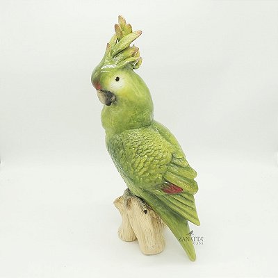 Calopsita G verde no tronco