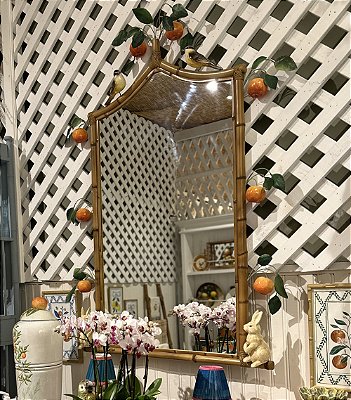 Espelho com galho de laranjas