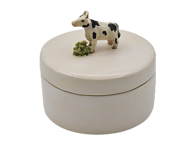 Caixa redonda com aplicação de vaca