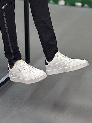 TÊNIS PUMA CAVEN 2.0 GOLD/NAVY