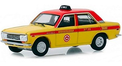 Miniatura Datsun 510 Taxi 1970 Tokyo Torque Amarelo 4 Portas 1/64 Greenlight