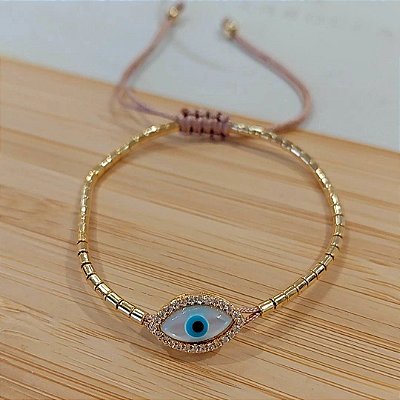 Pulseira canutilhos banhado a ouro com olho grego de madrepérola cravejado de zircônia