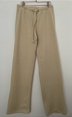 Calça tricot textura bolso atrás