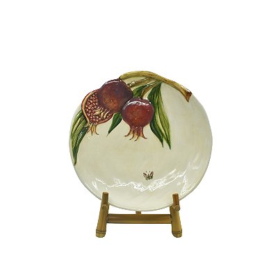 Prato sobremesa com relevo de romãs