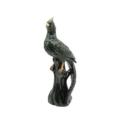 Escultura faisão verde no tronco