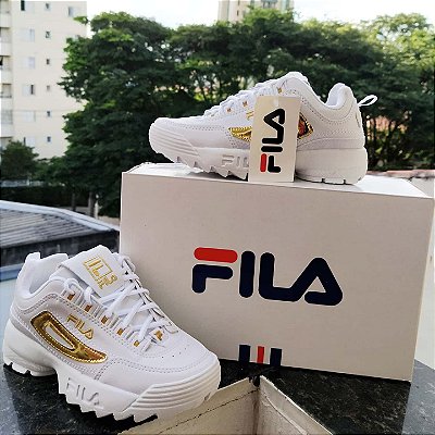 tenis fila disruptor dourado