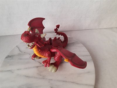 Dragão alado articulado com botão na costas que faz mexer as asas, sem marca, mede 15 cm de altura