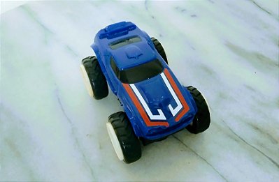 Miniatura Hot Wheels Rev Up 2008 roda também verticalmente