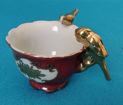 Mini xicara de chá decorativa com asa de dois passarinhos dourados made in Japan  3,5cm altura por 5cm de diâmetro