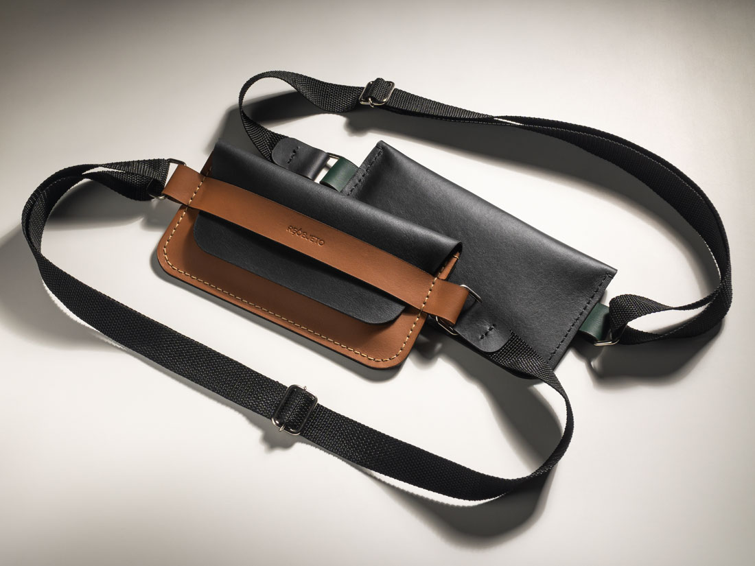 Bolsa Giro bicolor exibindo a frente e o verso nas variantes Caramelo+Preto e Verde+Preto.