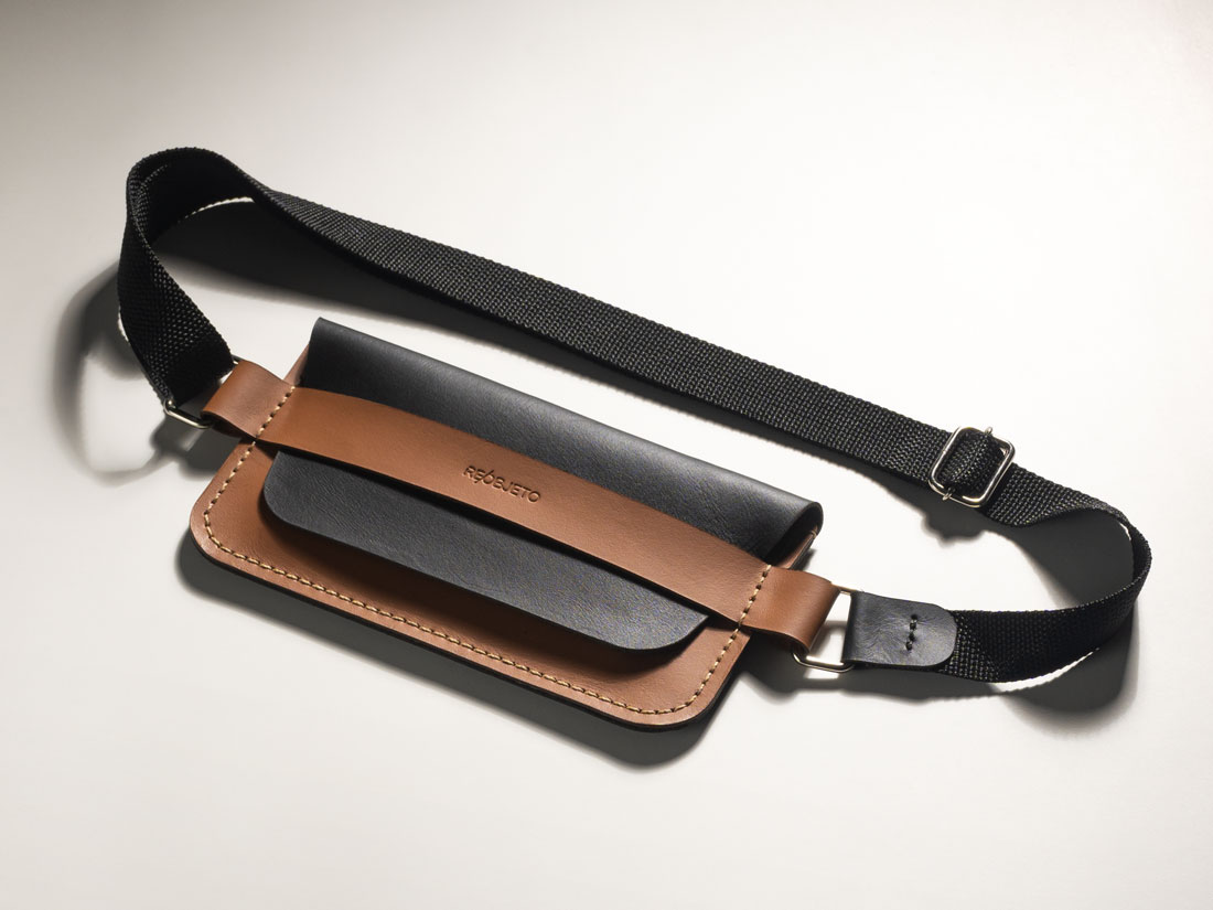 Bolsa pocket transversal Giro em couro bicolor Caramelo e Preto.