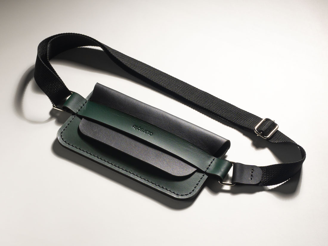 Bolsa pocket transversal Giro em couro bicolor Verde e Preto. Bolsa pocket transversal Giro em couro bicolor Verde e Preto.