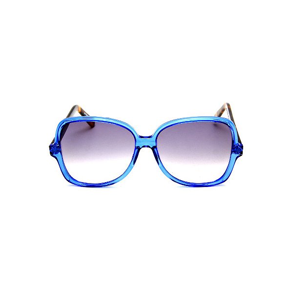 Óculos de Sol Gustavo Eyewear G110 3. Cor: Azul translúcido. Haste animal print. Lentes cinza.