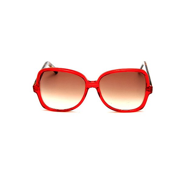 Óculos de Sol Gustavo Eyewear G110 4. Cor: Vermelho translúcido. Haste animal print. Lentes marrom.