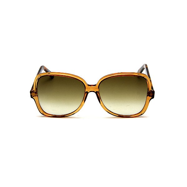 Óculos de Sol Gustavo Eyewear G110 7. Cor: Caramelo translúcido. Haste animal print. Lentes marrom.