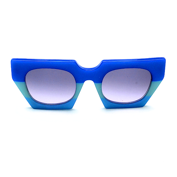 Óculos de Sol Gustavo Eyewear G137 5 em tons de azul e lentes cinza degrade. Novidades
