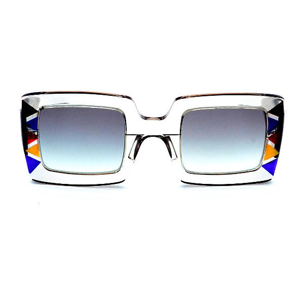 Óculos de Sol Gustavo Eyewear G01 4 em cristal com detalhes em azul, vermelho. Hastes fumê e lentes cinza degrade. Novidades