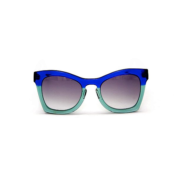 Óculos de sol Gustavo Eyewear G75 6. Cor: Azul translúcido e acqua. Haste azul. Lentes cinza.