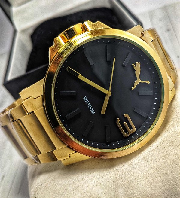 relogio puma dourado