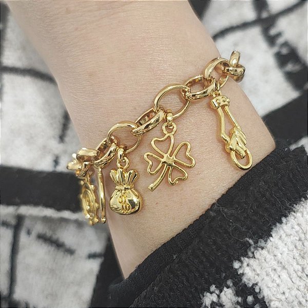 Pulseira Correntaria com pingentes de dinheiro, ferradura, trevo e figa e olho grego folheado em ouro ( fartura NOVO)