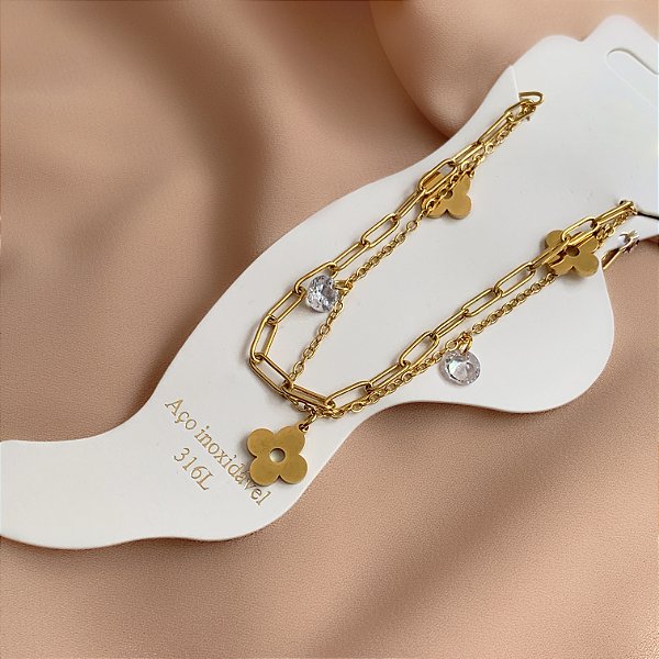 TORNOZELEIRA DUPLA PINGENTE TREVO E ZIRCÔNIAS DOURADO AÇO 316L⭐️