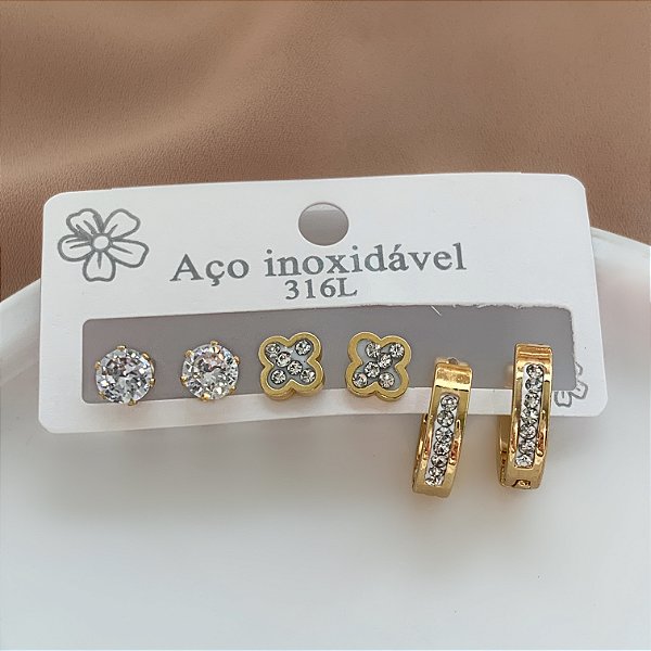 BRINCO KIT ARGOLINHA E TREVO ZIRCÔNIAS E PONTO DE LUZ DOURADO AÇO 316L⭐️