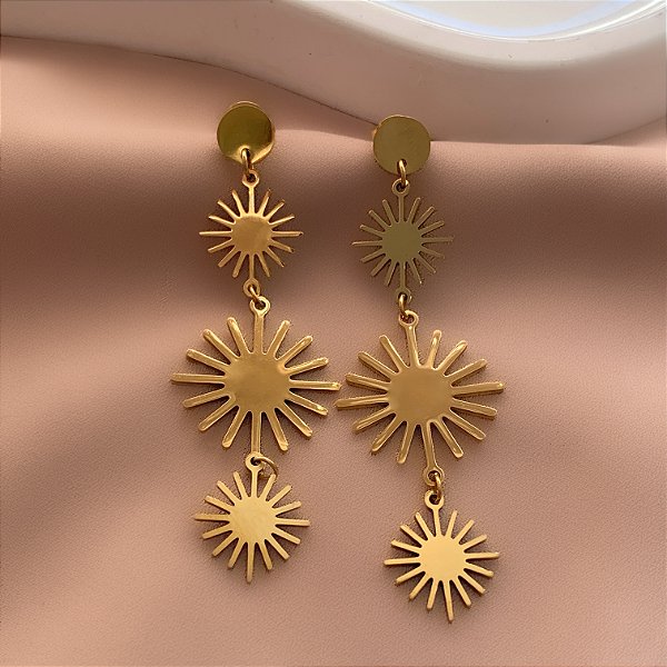 BRINCO RAIO SOLARES DOURADO AÇO 316L⭐️