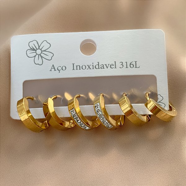 BRINCO KIT ARGOLINHAS FIO ACHATADO 1 COM ZIRCÔNIAS DOURADO AÇO 316L⭐️