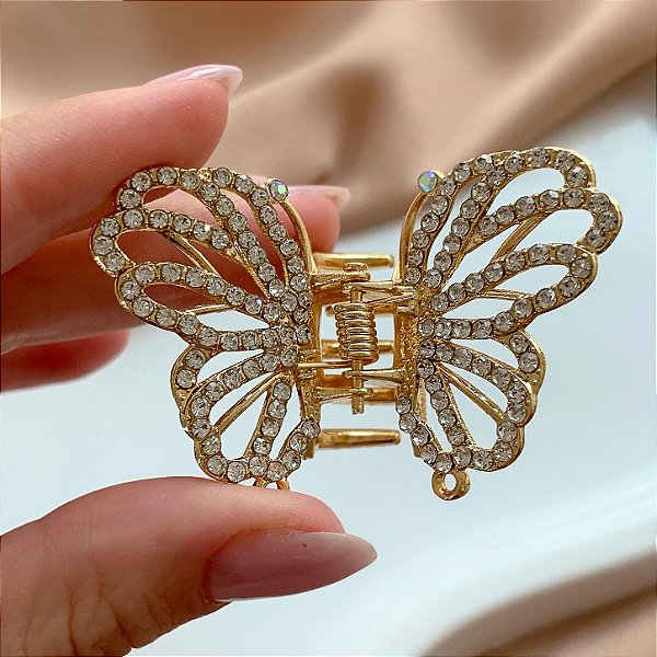 PRESILHA BORBOLETA CRAVEJADA STRASS DOURADO BIJU