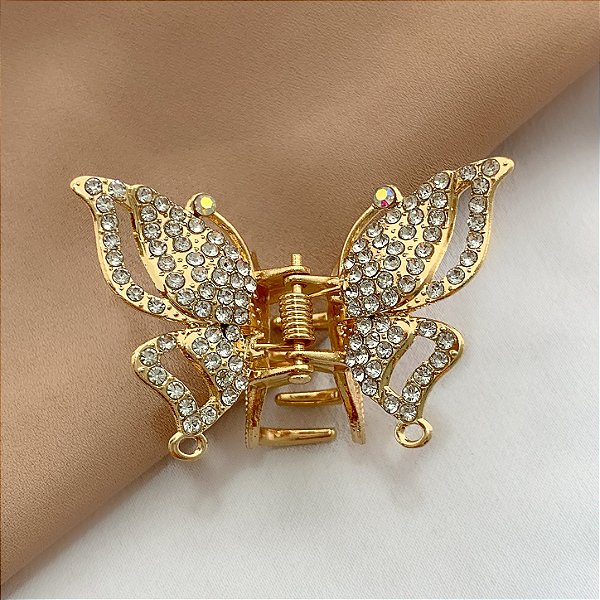 PRESILHA BORBOLETA ASAS PONTUDAS CRAVEJADA STRASS DOURADO BIJU