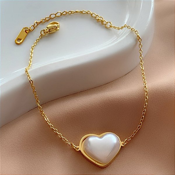 PULSEIRA PINGENTE CORAÇÃO EM PÉROLA DOURADO AÇO 316L⭐️