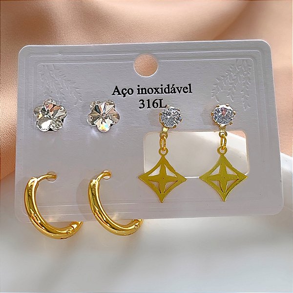 KIT DE BRINCOS TREVO PENDENTE, FLOR ZIRCÔNIA E ARGOLA DOURADO AÇO 316L⭐️