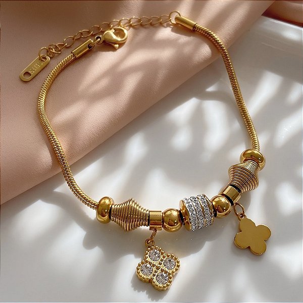 PULSEIRA PINGENTES TREVOS E ZIRCÔNIAS DOURADO AÇO 316L⭐️