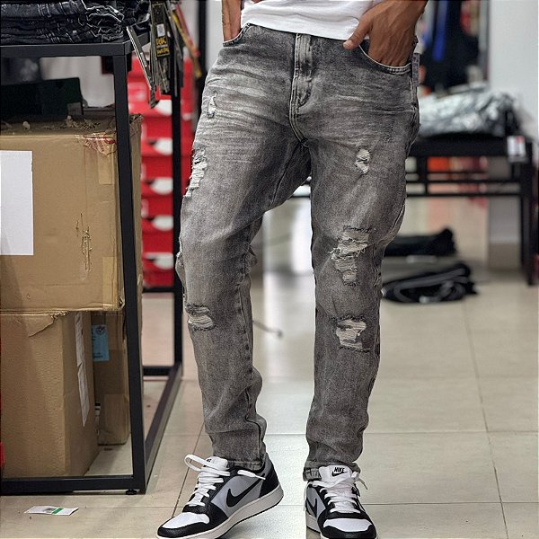 Calça jeans Titular marmotizada com rasgos