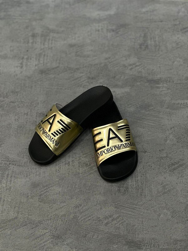 CHINELO SLIDE EMPÔRIO ARMANI EA7- DOURADO E PRETO
