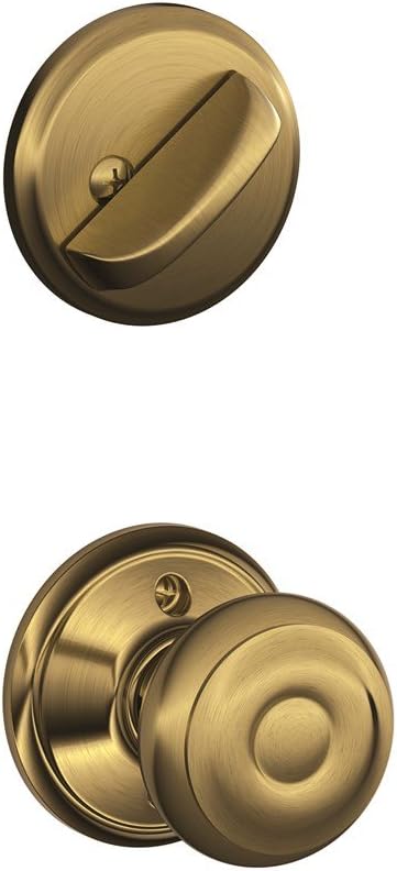 Schlage F59 GEO 609 Maçaneta interna com fechadura de embutir georgiana, latão antigo (Apenas metade interna)