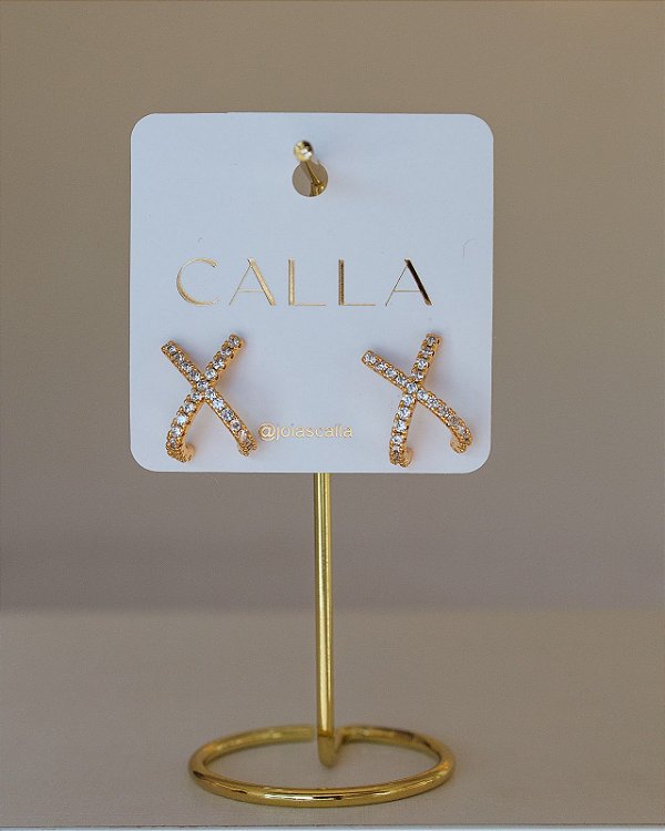 BRINCO X CRAVEJADO NO OURO