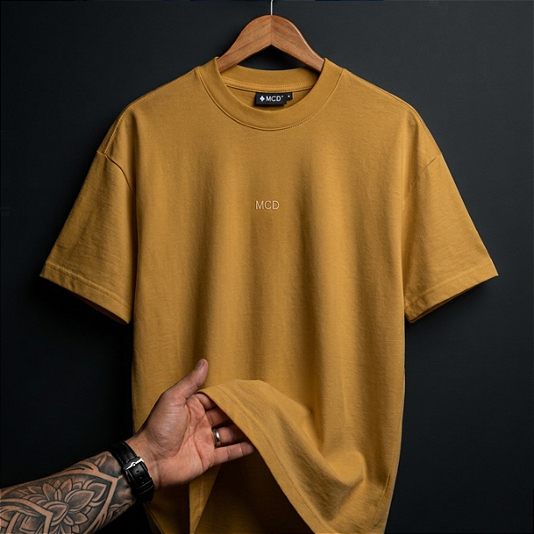 Camiseta Mcd Box Fit More Core Ocre Barbaro