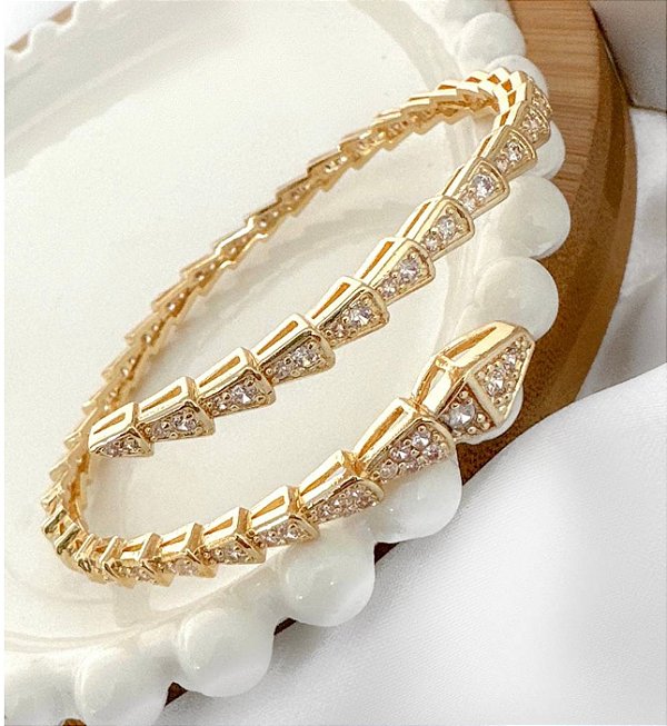 Bracelete KENDAL cobra cravejada verniz italiano dourado