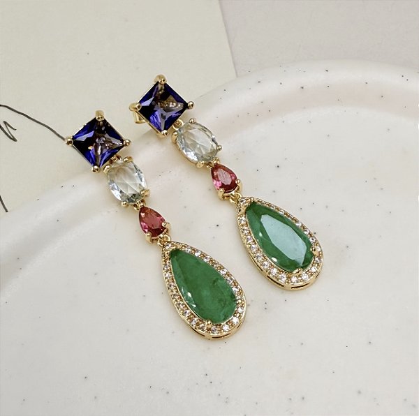 Brinco GUN pedra premium color (roxo, cristal, pink e verde) folheado a ouro