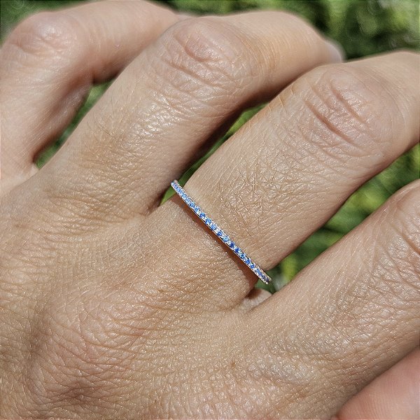 ANEL APARADOR DE PRATA COM ZIRCÔNIAS AZUIS