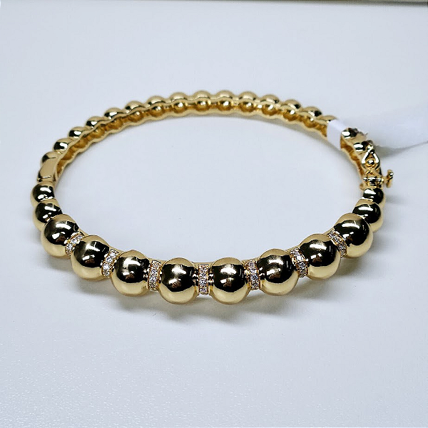 BRACELETE DOURADO DE BOLINHAS, METADE DO BRACELETE COM BOLINHAS LISA E ESPAÇADOR TODO CRAVEJADO